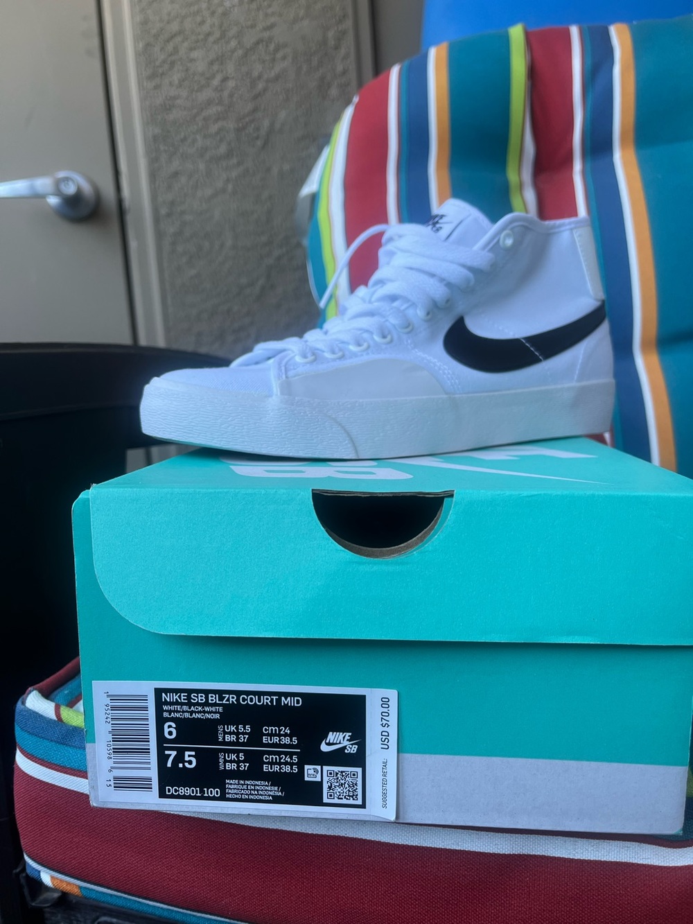 Nike White High-Top Sneakers with Black Swoosh - Picture 2 of 5